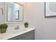 Powder room with gray vanity and marble countertop at 30 Willow Bend Dr, Youngsville, NC 27596