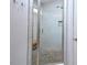 Walk-in shower with pebble floor and glass enclosure at 30 Willow Bend Dr, Youngsville, NC 27596