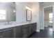 Double vanity bathroom with quartz countertop and dark cabinets at 370 Bellini Dr, Clayton, NC 27527