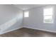 Charming bedroom with hardwood floors and two windows at 370 Bellini Dr, Clayton, NC 27527
