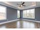 Spacious bedroom with hardwood floors and large windows at 370 Bellini Dr, Clayton, NC 27527