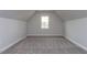 Spacious bedroom with grey carpet and a window at 370 Bellini Dr, Clayton, NC 27527