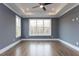 Bright bedroom with hardwood floors and large windows at 370 Bellini Dr, Clayton, NC 27527