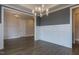 Formal dining room with wainscoting, hardwood floors, and a chandelier at 370 Bellini Dr, Clayton, NC 27527