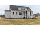 Two story house with grey siding, screened porch, and landscaped yard at 370 Bellini Dr, Clayton, NC 27527