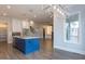 Open concept kitchen and dining area with an island and hardwood floors at 370 Bellini Dr, Clayton, NC 27527