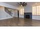 Spacious living room featuring a fireplace with a unique tile surround, built-in shelving, and hardwood floors at 370 Bellini Dr, Clayton, NC 27527