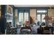 Elegant living room featuring a fireplace and scenic mural at 2606 Marchmont St # 102, Raleigh, NC 27608