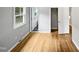 Well-lit bedroom with hardwood floors and access to a hallway at 1526 Clermont Rd, Durham, NC 27713