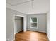 Simple bedroom with hardwood floors and a large closet at 1526 Clermont Rd, Durham, NC 27713