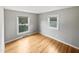 Bright bedroom with hardwood floors and two windows at 1526 Clermont Rd, Durham, NC 27713