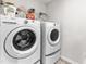 Laundry room with washer, dryer, and shelving at 52 E Piston Pt, Clayton, NC 27520