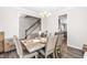 Dining room with a wooden table, six chairs, and a view of the kitchen at 52 E Piston Pt, Clayton, NC 27520