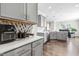 Gray cabinets and quartz countertops in this well-equipped kitchen at 52 E Piston Pt, Clayton, NC 27520