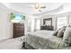 Main bedroom with a king-size bed and en-suite bathroom at 52 E Piston Pt, Clayton, NC 27520
