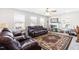 Bright bonus room with leather furniture and large windows at 52 E Piston Pt, Clayton, NC 27520