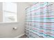 Small bathroom with shower and patterned curtain at 52 E Piston Pt, Clayton, NC 27520