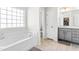 Bathroom featuring a garden tub, separate shower, and double vanity at 52 E Piston Pt, Clayton, NC 27520