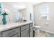 Bathroom with gray vanity, quartz countertop, and shower at 52 E Piston Pt, Clayton, NC 27520