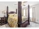 Main bedroom with a large four poster bed and ample light at 52 E Piston Pt, Clayton, NC 27520
