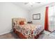 Bedroom with double bed and orange accents at 52 E Piston Pt, Clayton, NC 27520