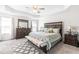 Spacious main bedroom with large bed, ceiling fan, and dresser at 52 E Piston Pt, Clayton, NC 27520