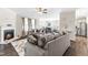 Open living room with fireplace and access to kitchen at 52 E Piston Pt, Clayton, NC 27520