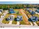 Aerial view of a neighborhood with houses and a park-like setting at 52 E Piston Pt, Clayton, NC 27520