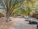 Parking lot with cars and autumn leaves at 3158 Morningside Dr, Raleigh, NC 27607