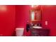 Small bathroom with red walls and dark vanity at 3158 Morningside Dr, Raleigh, NC 27607