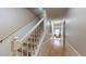Interior view of a carpeted staircase with wooden railing at 3158 Morningside Dr, Raleigh, NC 27607