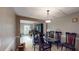 Dining area with glass-top table and view into living room at 3158 Morningside Dr, Raleigh, NC 27607