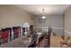 Dining room with glass-top table and striped wallpaper at 3158 Morningside Dr, Raleigh, NC 27607