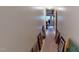 Long hallway with framed pictures and doors at 3158 Morningside Dr, Raleigh, NC 27607