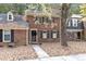 Brick townhome with walkway, surrounded by trees at 3158 Morningside Dr, Raleigh, NC 27607