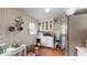Bright kitchen features white cabinets and tile floors at 3158 Morningside Dr, Raleigh, NC 27607