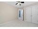 Spacious bedroom with ceiling fan, double door closet and access to hallway at 2106 White Pond Ct, Apex, NC 27523