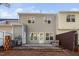 Townhouse backyard with deck, patio, and wooden bench at 2106 White Pond Ct, Apex, NC 27523
