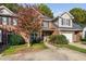 Brick townhouse with two-car garage and landscaping at 2106 White Pond Ct, Apex, NC 27523