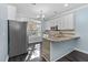 Modern kitchen with granite island and stainless steel appliances at 2106 White Pond Ct, Apex, NC 27523