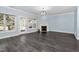 Light-filled living room with fireplace and access to deck at 2106 White Pond Ct, Apex, NC 27523