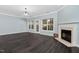 Spacious living room featuring a fireplace and hardwood floors at 2106 White Pond Ct, Apex, NC 27523
