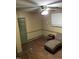 Bedroom with wood-look floors, ceiling fan, and chaise lounge at 206 W Garner Rd, Garner, NC 27529