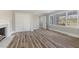 Bedroom with hardwood floors, fireplace and large windows at 203 W Stewart St, Coats, NC 27521