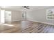 Spacious bedroom with hardwood floors and multiple windows at 203 W Stewart St, Coats, NC 27521