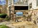 Built-in outdoor kitchen with stone accents at 110 Bywater Way, Chapel Hill, NC 27516