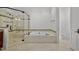 Bathroom features a large soaking tub, walk-in shower, and updated fixtures at 110 Bywater Way, Chapel Hill, NC 27516