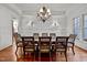 Elegant dining room featuring a large table, chandelier, and hardwood floors at 110 Bywater Way, Chapel Hill, NC 27516
