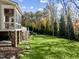Landscaped backyard with stone pathway and green space at 110 Bywater Way, Chapel Hill, NC 27516