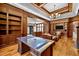 Spacious library with a large desk, bookshelves, and a view to another room at 110 Bywater Way, Chapel Hill, NC 27516